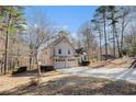 Attractive two-story home featuring a three-car garage situated on a spacious lot with mature trees at 146 Crowell Se Rd, Conyers, GA 30094