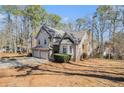 Beautiful two-story home with a three-car garage, and inviting entryway, nestled in a tranquil, wooded lot at 146 Crowell Se Rd, Conyers, GA 30094