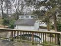 Backyard view from the deck, showcasing a pool and the garage at 1867 Dresden Dr, Atlanta, GA 30319