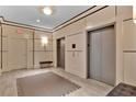 Elegant lobby area showcasing elevator access, accented by decorative lighting, creating an inviting ambiance at 2828 Peachtree Nw Rd # 1402, Atlanta, GA 30305
