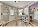 Charming entryway with coat hooks, a coffee bar, and a bright window with a view outside at 627 Rock Springs Rd, Lawrenceville, GA 30043
