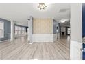 Bright and airy living room boasts elegant wainscoting, light-colored wood floors, and an open layout at 4526 Balto Way, Acworth, GA 30101