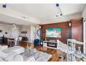 Cozy living room with a fireplace, mounted television, modern decor, and hardwood floors at 4561 Olde Perimeter Way # 2609, Atlanta, GA 30346