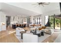 Open-concept living area with modern kitchen, comfortable seating, and expansive windows at 4555 Mystic Dr, Atlanta, GA 30342