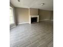 Spacious living room featuring a cozy fireplace and stylish gray tile flooring at 4807 Hairston, Stone Mountain, GA 30088