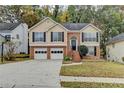 Charming two-story home with a well-manicured lawn, a two-car garage, and beautiful landscaping at 4224 Berkeley Mill Close, Duluth, GA 30096