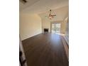 Bright living room featuring vaulted ceilings, fireplace, ceiling fan and hardwood floors at 413 Chippewa Se Dr, Acworth, GA 30102