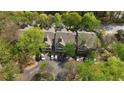 Aerial view of a condominium building surrounded by lush green trees and parking at 446 Mcgill Ne, Atlanta, GA 30312