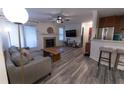 Comfortable living room featuring a fireplace, modern lighting and wood flooring at 446 Mcgill Ne, Atlanta, GA 30312