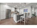 Modern kitchen featuring white cabinetry, stainless steel appliances, and an island with bar seating at 270 17Th Nw St # 2804, Atlanta, GA 30363