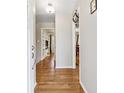 Bright entryway featuring hardwood floors, neutral paint, and views of a home office and dining room at 731 Fern Se St, Marietta, GA 30067