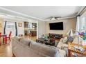 Cozy living room featuring hardwood floors, comfortable seating, and an open view into the dining area and kitchen at 731 Fern Se St, Marietta, GA 30067