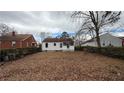 Expansive backyard, perfect for outdoor activities and relaxation, surrounded by mature trees at 2447 Crestview Ave, Decatur, GA 30032