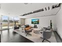 Spacious common lounge area with modern furniture, TV, and a relaxing ambiance at 361 17Th Nw St # 1717, Atlanta, GA 30363