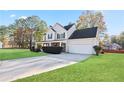 Well-maintained home with a spacious driveway and manicured landscaping at 12 Windcrest, Covington, GA 30016