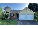 Charming single-story home with a two-car garage and a well-maintained lawn at 2820 Skye Ter, Duluth, GA 30096