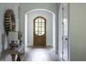 Elegant foyer featuring arched doorway and wood floors at 64 Telfair Ct, Acworth, GA 30101