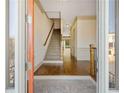 Bright foyer features elegant hardwood floors and staircase leading to the upper level at 961 Persimmon Pt, Atlanta, GA 30328