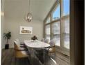 Bright dining room with large windows, modern light fixture, and stylish table set at 3559 Sawmill Ter, Marietta, GA 30062