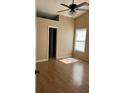 Bedroom with laminate flooring, natural light, a ceiling fan, and neutral paint at 740 Kibbe Cir, Lawrenceville, GA 30044