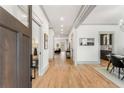Bright and airy foyer with hardwood floors, leading to dining area, living room, and kitchen at 1055 Ormewood Se Ave, Atlanta, GA 30316