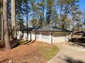 Detached garage with white brick and a large garage door at 1332 Willis Mill Sw Rd, Atlanta, GA 30311
