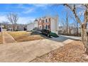 Two-story brick home with well-maintained landscaping and a long driveway at 4508 Ashmore Circle Cir, Marietta, GA 30066