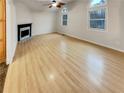 Spacious living room with a black fireplace and abundant natural light from large windows at 832 Overlook Trl, Canton, GA 30115