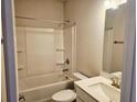 Clean, bright bathroom with shower-tub combo, vanity and modern fixtures at 112 Scarlett Place Dr, Bowdon, GA 30108
