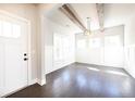 Charming dining room featuring natural wood ceiling beams, board and batten, and hardwood flooring at 2076 Greenridge Se Rd, Smyrna, GA 30080