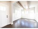 Inviting dining area with hardwood floors, wood beam ceiling, and ample natural light at 2076 Greenridge Se Rd, Smyrna, GA 30080
