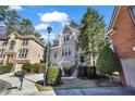 Charming two-story brick home with manicured landscaping, a two-car garage, and classic curb appeal at 1129 Gavinwood Pl, Decatur, GA 30033