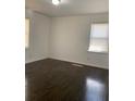 A sunny bedroom with a hardwood floor and two windows brings in natural light at 1649 Ezra Church Nw Dr, Atlanta, GA 30314