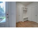 Mudroom features storage cubbies and a door to the backyard for easy access at 71 Malcom Rd, Covington, GA 30014