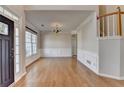 Dining room featuring hardwood floors, wainscoting, and a staircase at 1541 Towne Park Ct, Lawrenceville, GA 30044