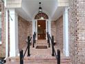 Inviting brick front entrance with decorative columns and arched doorway at 2513 Galloways Farm Drive Nw, Acworth, GA 30101