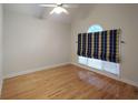 Bright living room featuring vaulted ceiling, hardwood floors, and custom window treatment at 2513 Galloways Farm Drive Nw, Acworth, GA 30101