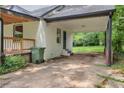 The carport features a concrete floor and brick column, providing covered parking at 444 Sargent Se Dr, Atlanta, GA 30315