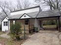 Cozy home featuring a covered porch, brick accents, and a convenient carport at 444 Sargent Se Dr, Atlanta, GA 30315