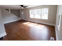 Inviting living room featuring hardwood floors and large windows for natural light at 444 Sargent Se Dr, Atlanta, GA 30315