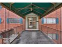 This apartment building's main entrance features a covered walkway with a bench at 91 Rumson Ne Rd # C32, Atlanta, GA 30305