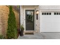 Close up of the front door showing the dark olive paint, craftsman style, and address number at 174 Sidney St, Marietta, GA 30060