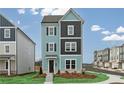 New construction home featuring blue siding, black shutters, well-maintained lawn and sidewalk at 512 Aberdeen Meadow Ln, Acworth, GA 30102