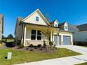 Charming home with brick accents, a two-car garage, and a well-kept lawn at 2785 Lifford Way, Duluth, GA 30097