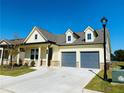 Inviting home featuring a two-car garage, tidy landscaping, and a welcoming facade at 2785 Lifford Way, Duluth, GA 30097