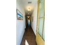 Bright hallway with hardwood floors, white walls, and natural light from the front door at 2785 Lifford Way, Duluth, GA 30097