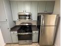 Well-equipped kitchen features stainless steel appliances and ample cabinet space at 251 Margaret St, Fairburn, GA 30213