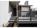 Cozy front porch with gray railings, a black front door, and a welcoming mat at 3934 Conley Downs Ln, Decatur, GA 30034
