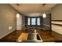 Bright kitchen featuring modern pendants, butcherblock counters, and stainless sink at 163 Woodwind Way, Jonesboro, GA 30238