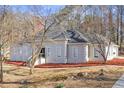 View of house showing well-maintained landscape and architectural details at 6010 Canaan Woods Dr, South Fulton, GA 30331